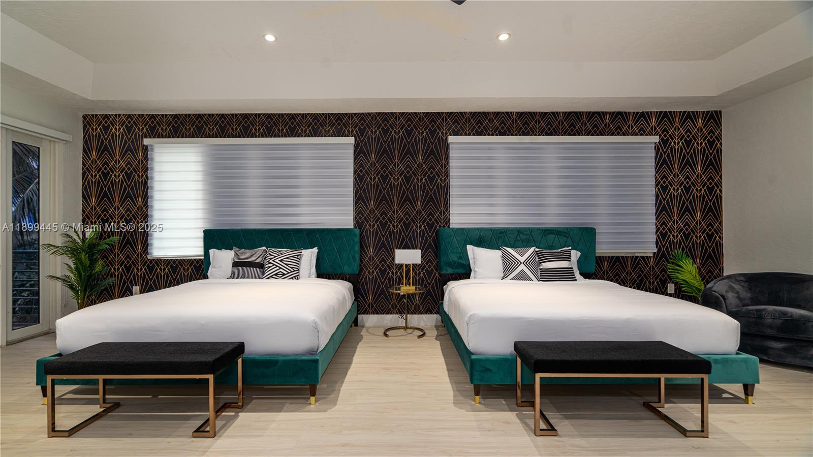 112 Northwest 14th Way Dania Beach, FL 33004 - Photo 16 of 42 a bedroom with two beds and a table