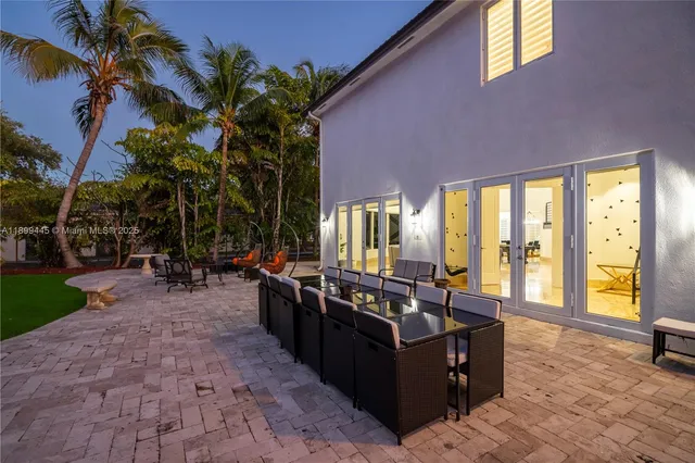 a living room filled with furniture and a potted plant