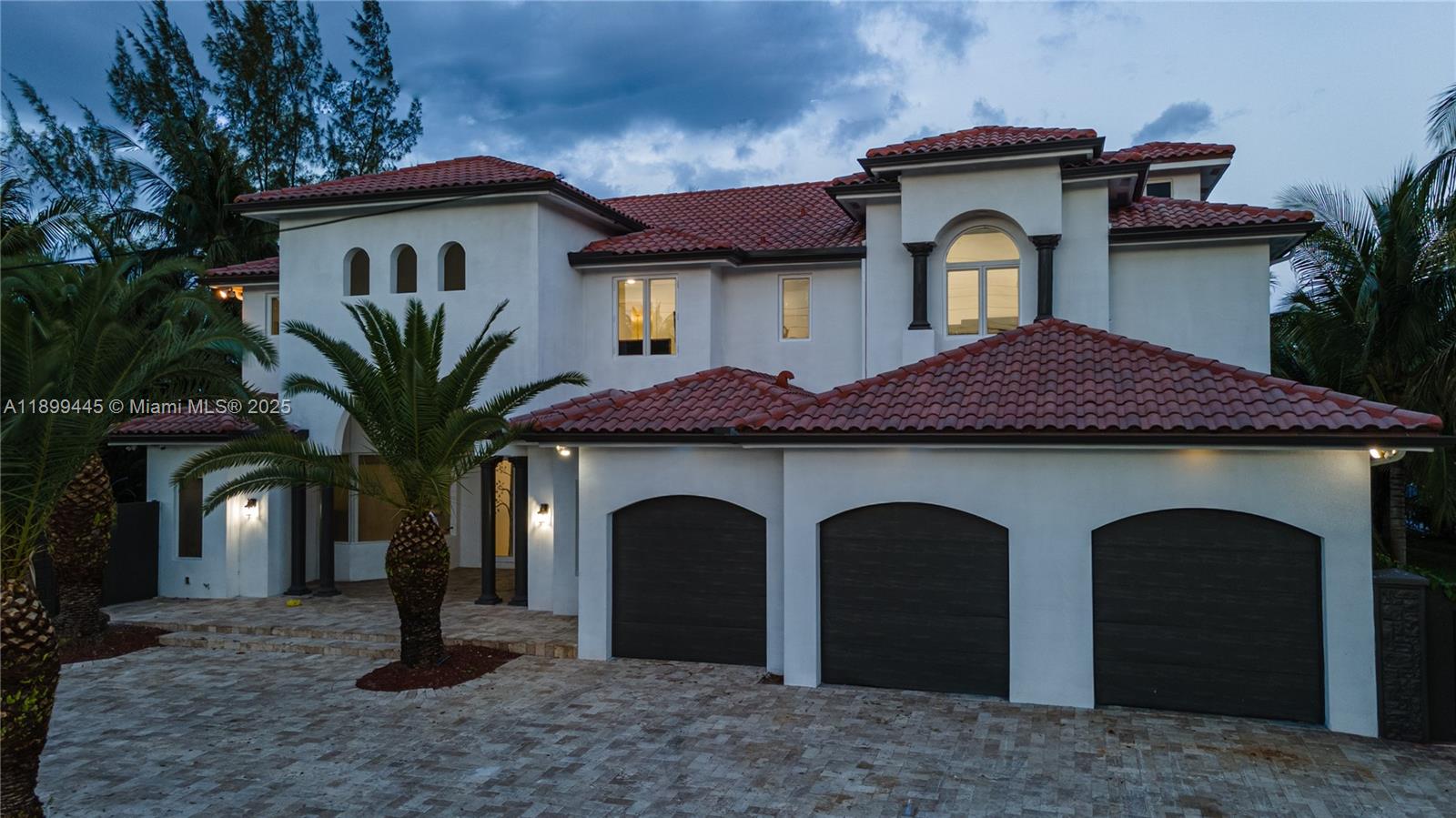 112 Northwest 14th Way Dania Beach, FL 33004 - Photo 40 of 42 a front view of a house with a yard and garage