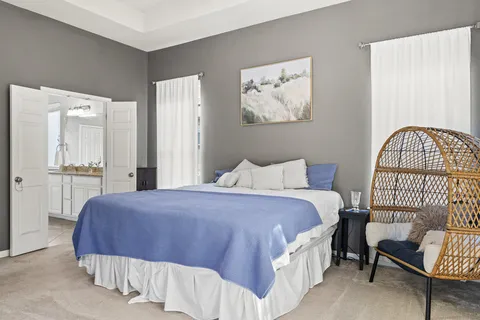 a bedroom with a bed and a table