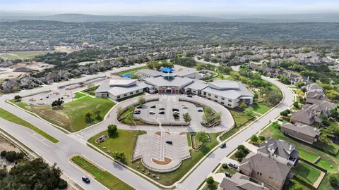 an aerial view of a house swimming pool and outdoor seating