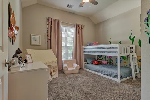 a bedroom with furniture and a couch