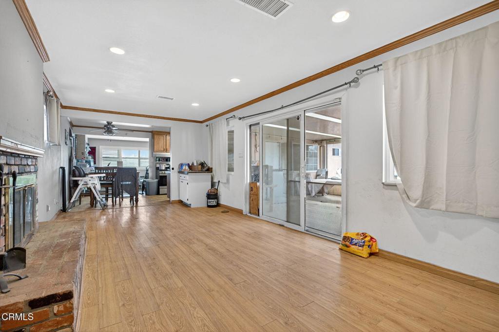 4105 South J Street Oxnard, CA 93033 - Photo 12 of 26 a livingroom with furniture and wooden floor