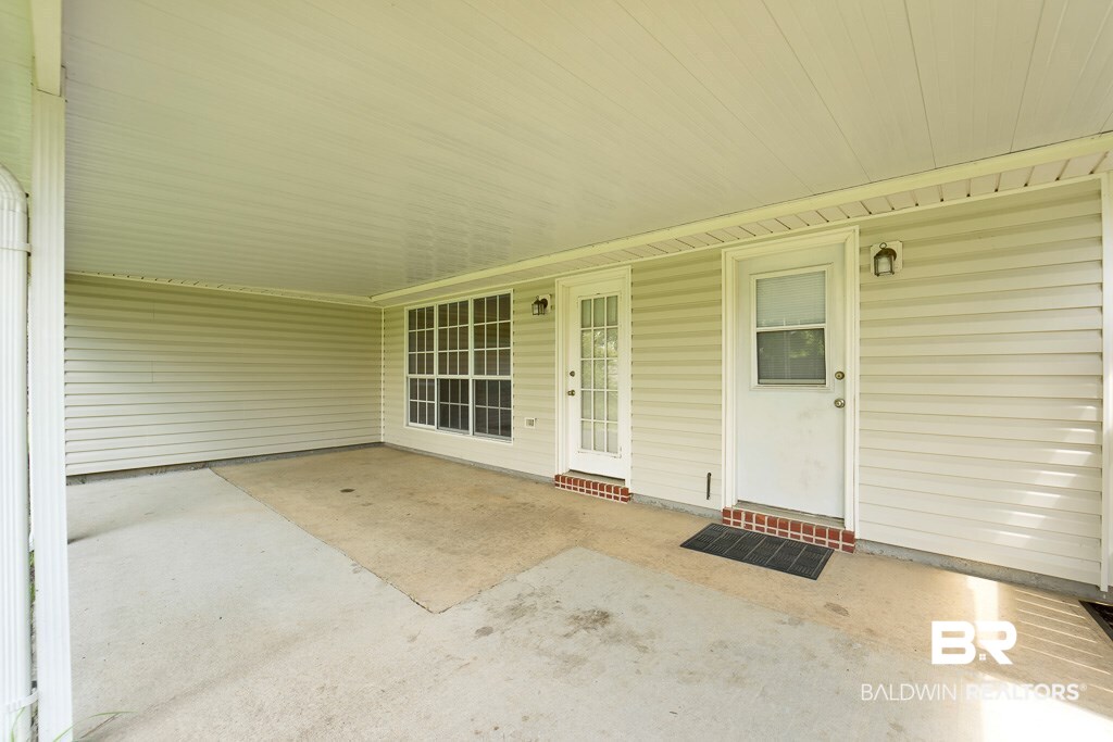 9385 Prairie Drive Semmes, AL 36575 - Photo 14 of 19 335 sq feet of covered back porch!