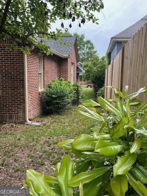 311 3rd Street Manchester, GA 31816 - Photo 61 of 62 a backyard of a house with lots of green space