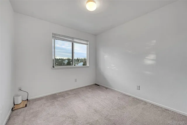 a bathroom with a toilet a sink a mirror a bathtub and vanity