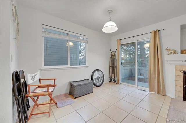 a view of a livingroom with furniture and windows