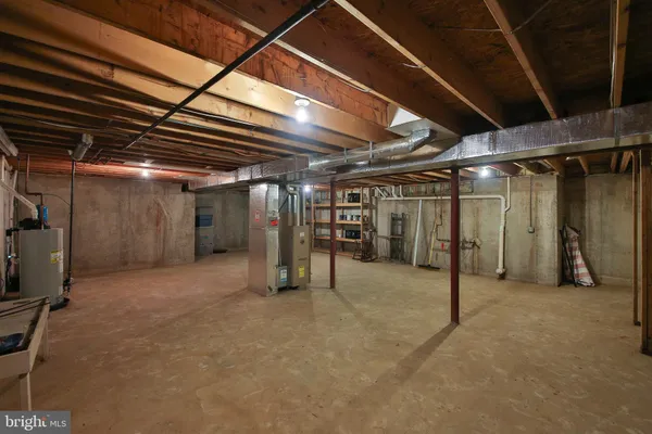 a view of empty room with wooden ceiling