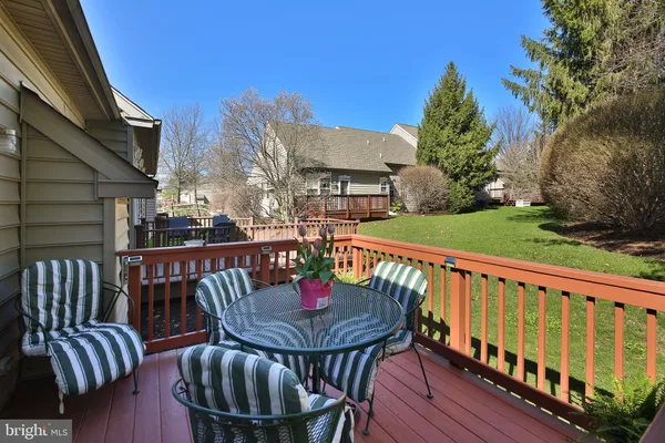 a view of a chairs and table on the deck