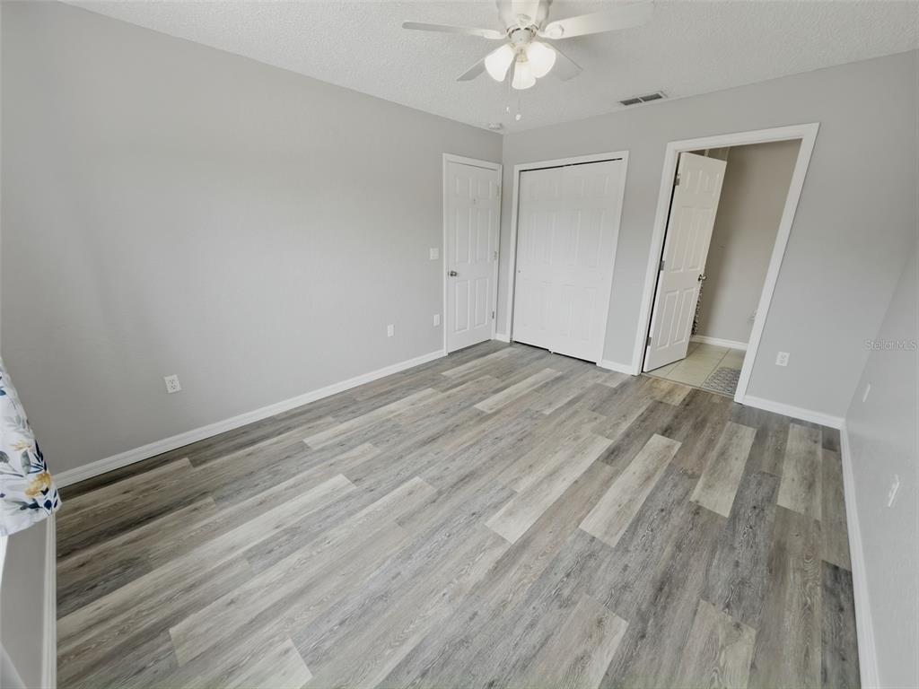 2202 Godfrey Avenue Spring Hill, FL 34609 - Photo 19 of 36 wooden floor in an empty room