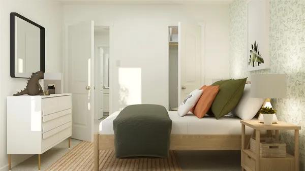 a bedroom with a bed and a mirror
