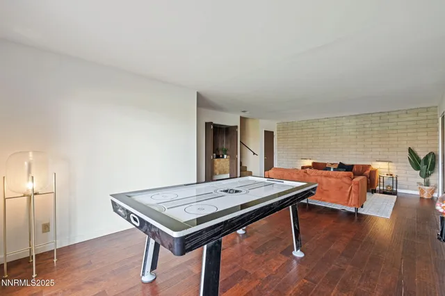 a view of a room with a table and chairs