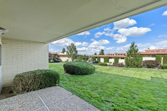 a view of a backyard with garden