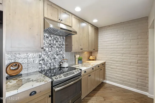 a kitchen with a stove and a sink