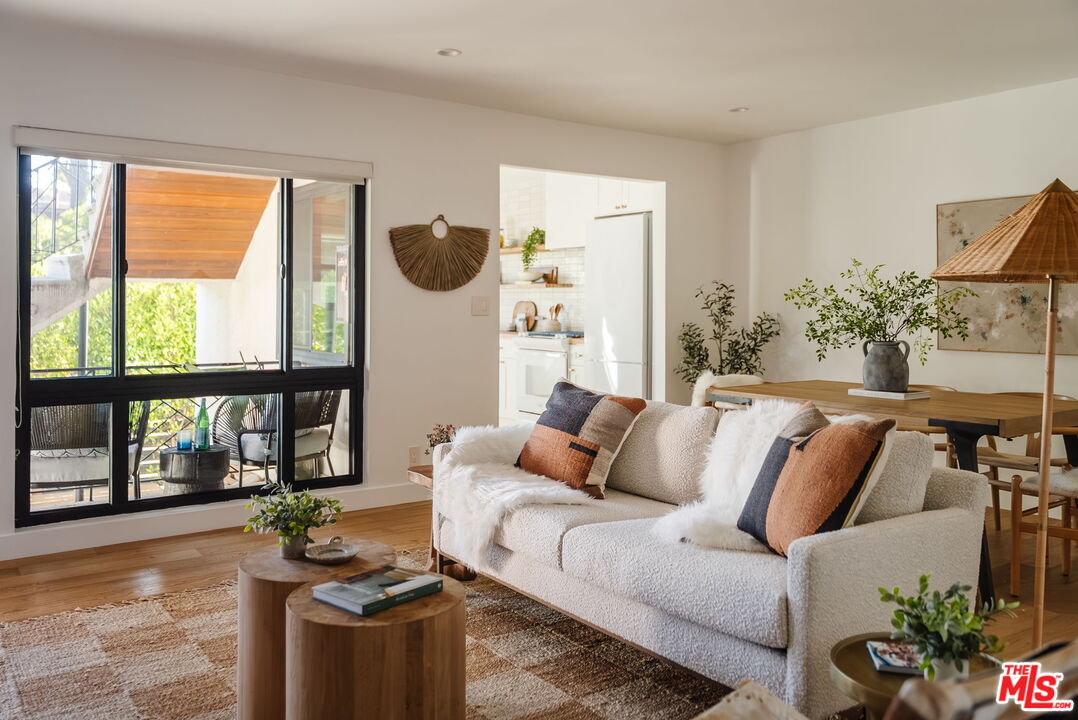 1943 12th, Unit B Santa Monica, CA 90404 - Photo 19 of 37 a living room with furniture and a large window