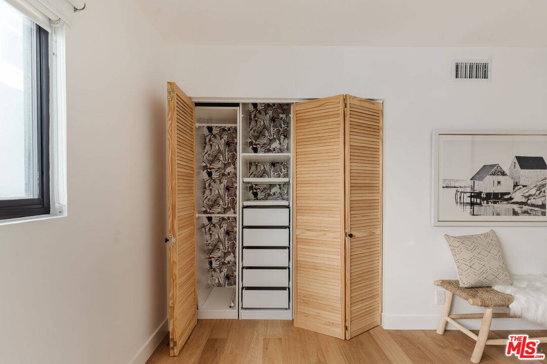 1943 12th, Unit B Santa Monica, CA 90404 - Photo 21 of 37 a view of walk in closet with clothes and shoes