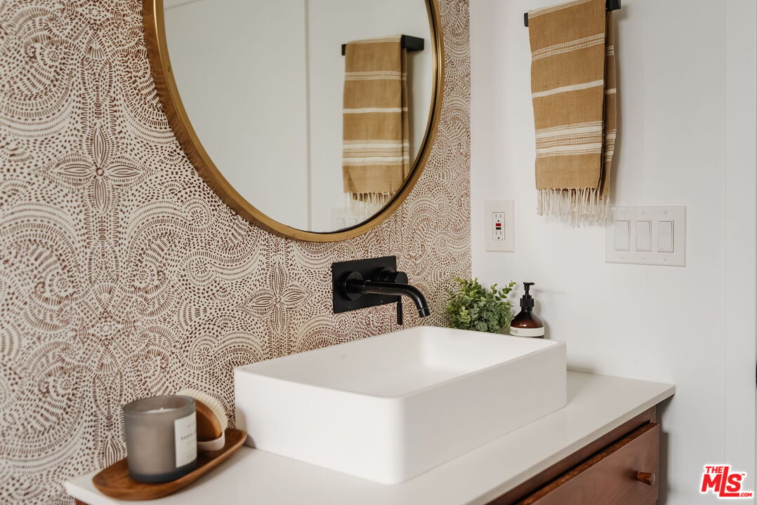 1943 12th, Unit B Santa Monica, CA 90404 - Photo 9 of 37 a bathroom with a sink and a mirror