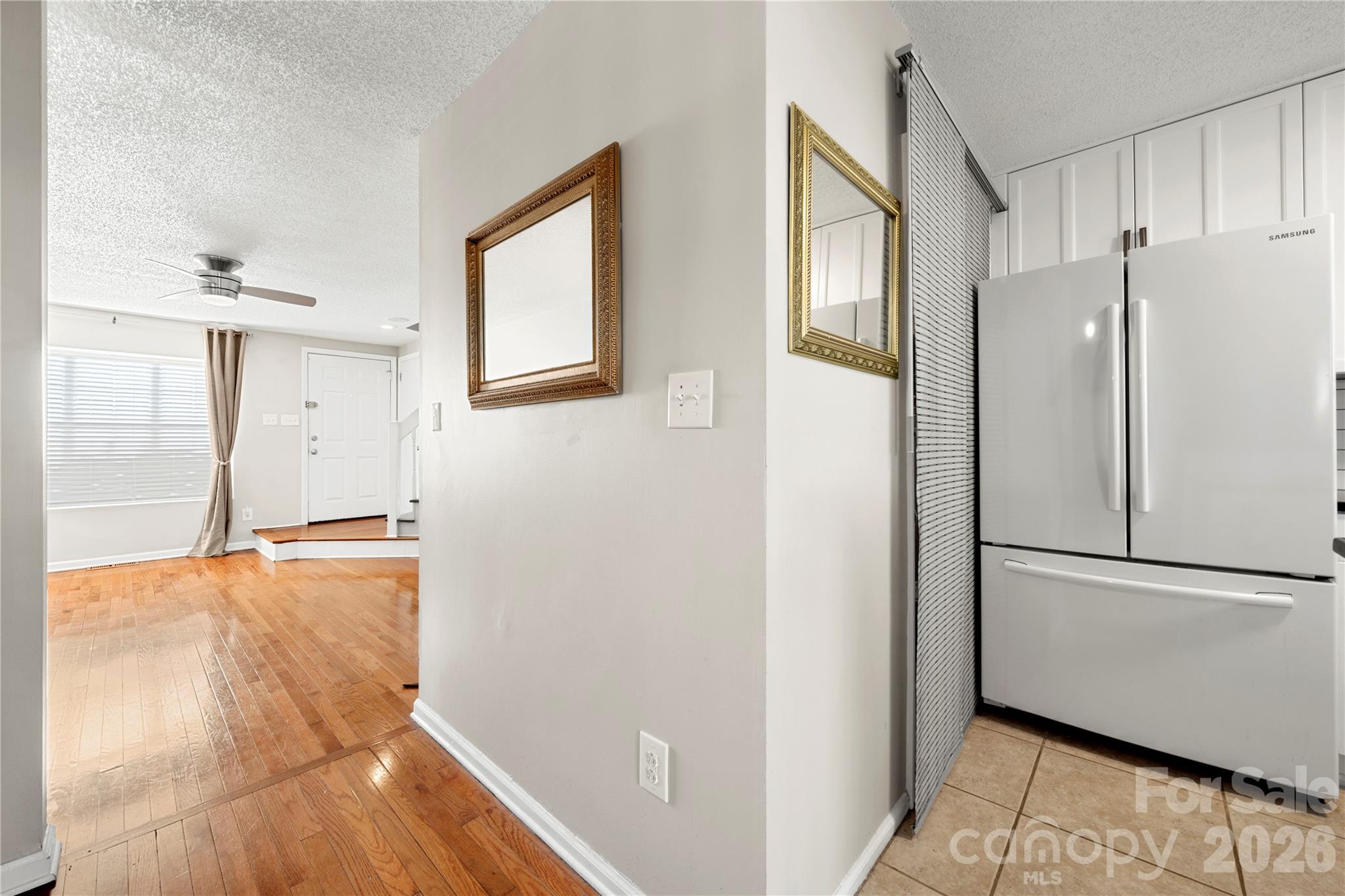 8240 Circle Tree Lane Charlotte, NC 28277 - Photo 14 of 29 a view of empty room with wooden floor and electronic appliances