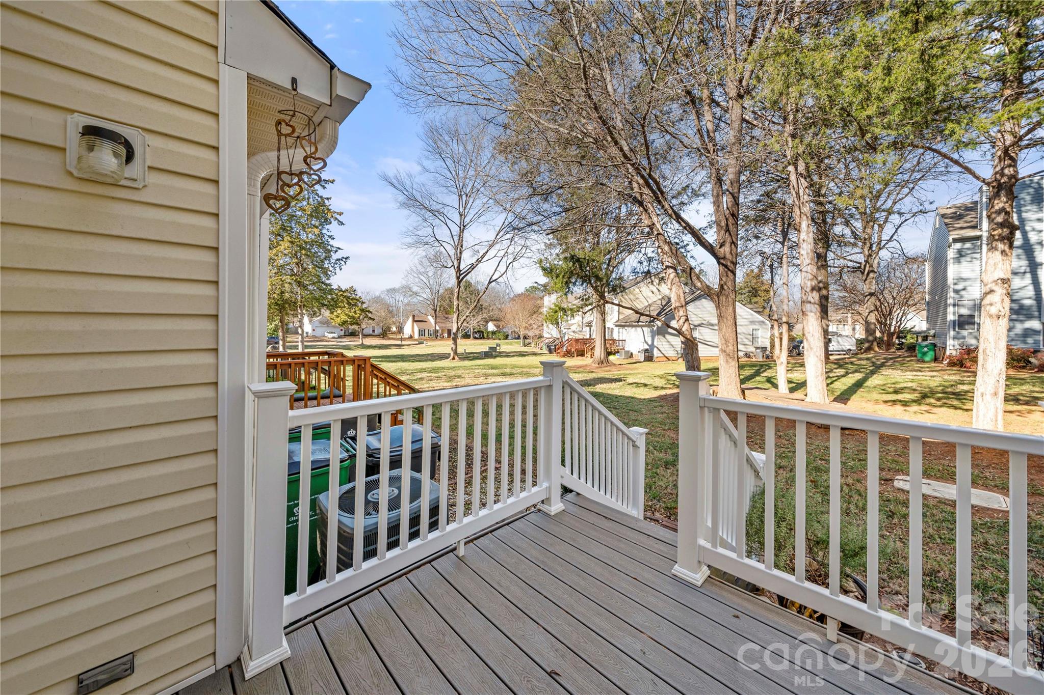 8240 Circle Tree Lane Charlotte, NC 28277 - Photo 22 of 29 a view of a balcony with wooden floor and fence and a bench