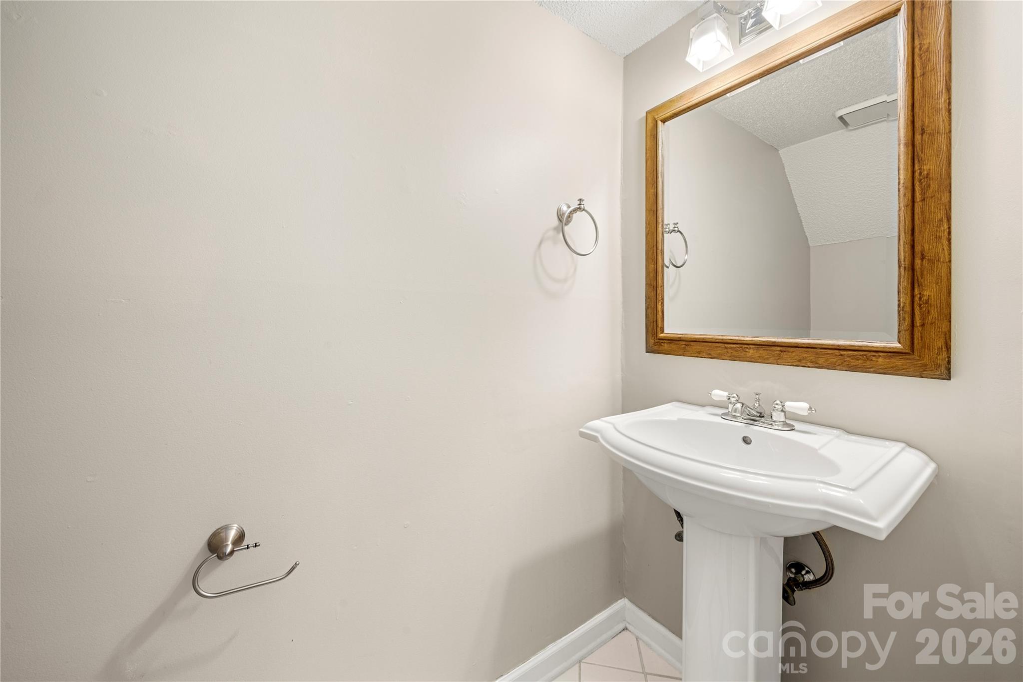 8240 Circle Tree Lane Charlotte, NC 28277 - Photo 4 of 29 a bathroom with a sink and a mirror