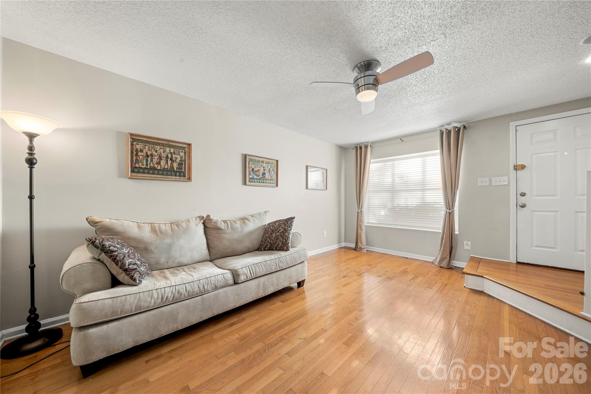 8240 Circle Tree Lane Charlotte, NC 28277 - Photo 5 of 29 a living room with furniture and a window