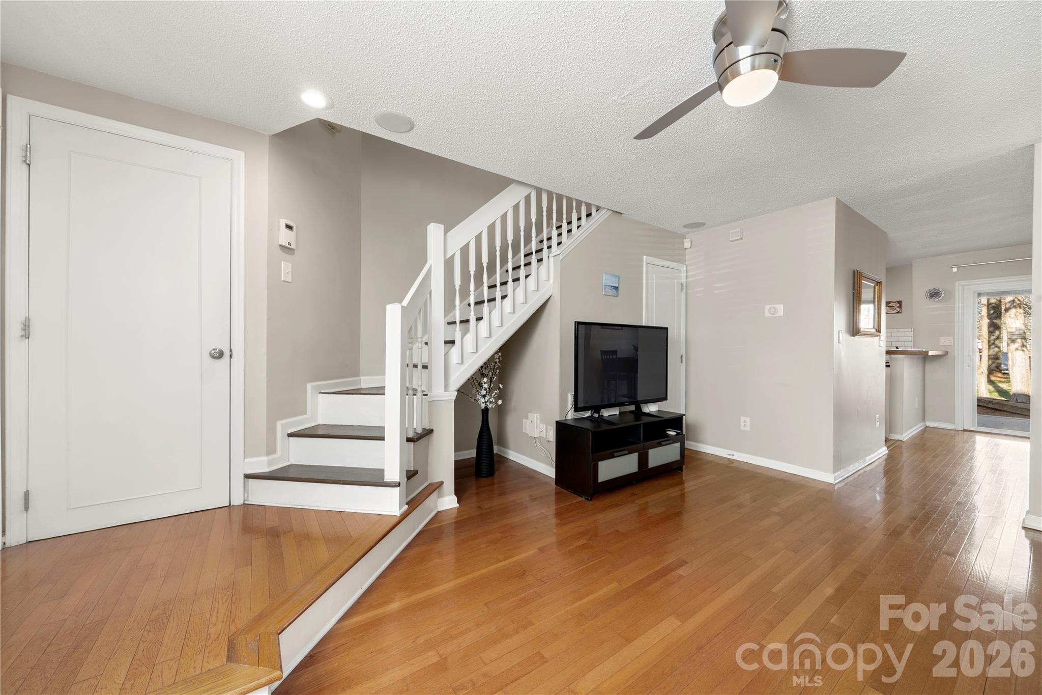 8240 Circle Tree Lane Charlotte, NC 28277 - Photo 7 of 29 a view of a livingroom with wooden floor and furniture