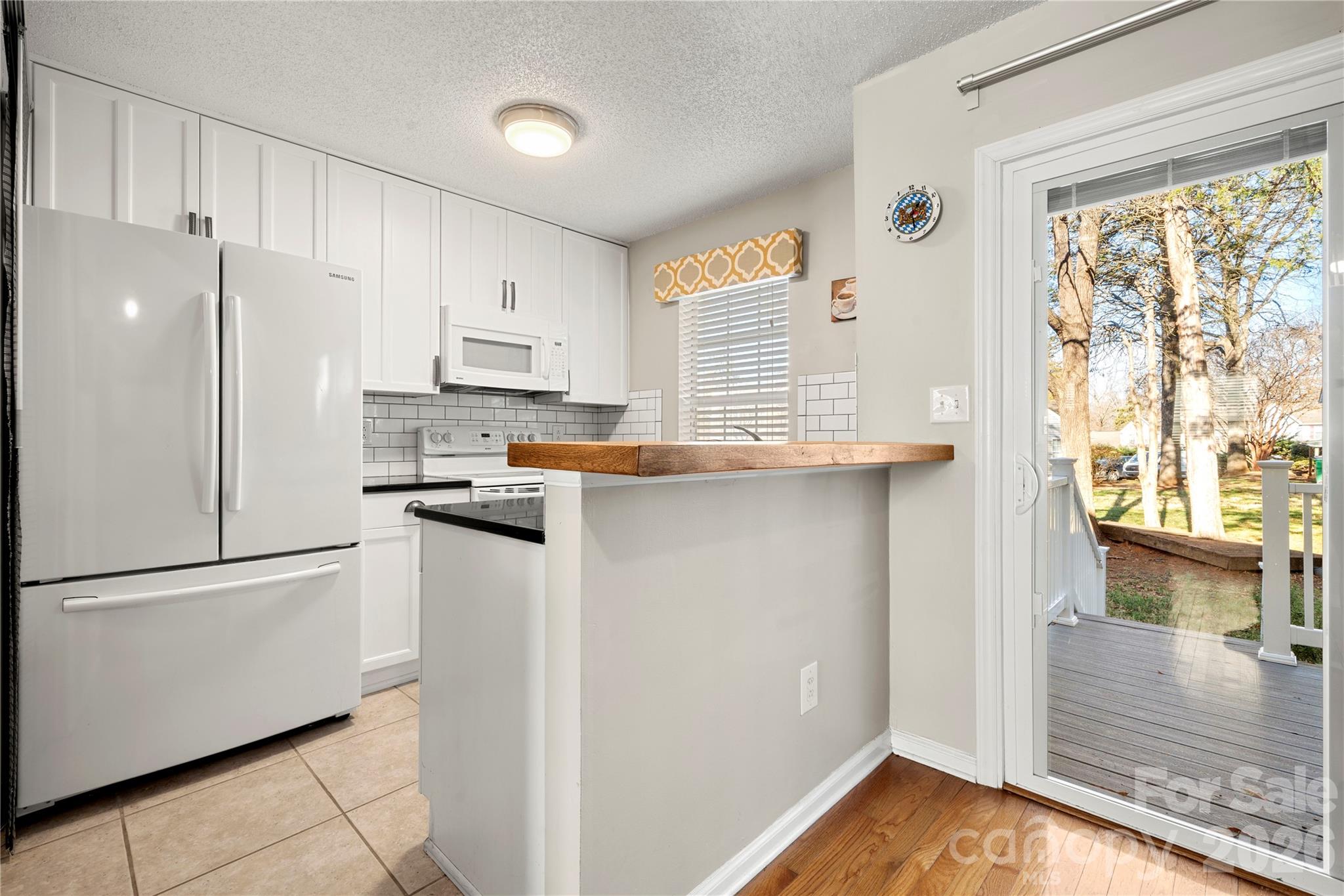 8240 Circle Tree Lane Charlotte, NC 28277 - Photo 10 of 29 a kitchen with stainless steel appliances granite countertop a refrigerator and a stove