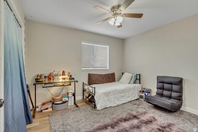 933 South Freedom Boulevard, Unit 7 Provo, UT 84601 - Photo 13 of 23 Bedroom with ceiling fan and wood finished floors