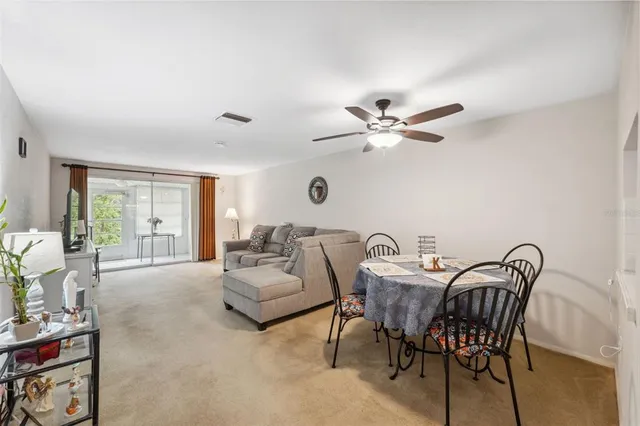 a work room with furniture and a large window