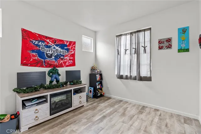 a room with furniture and flat screen tv