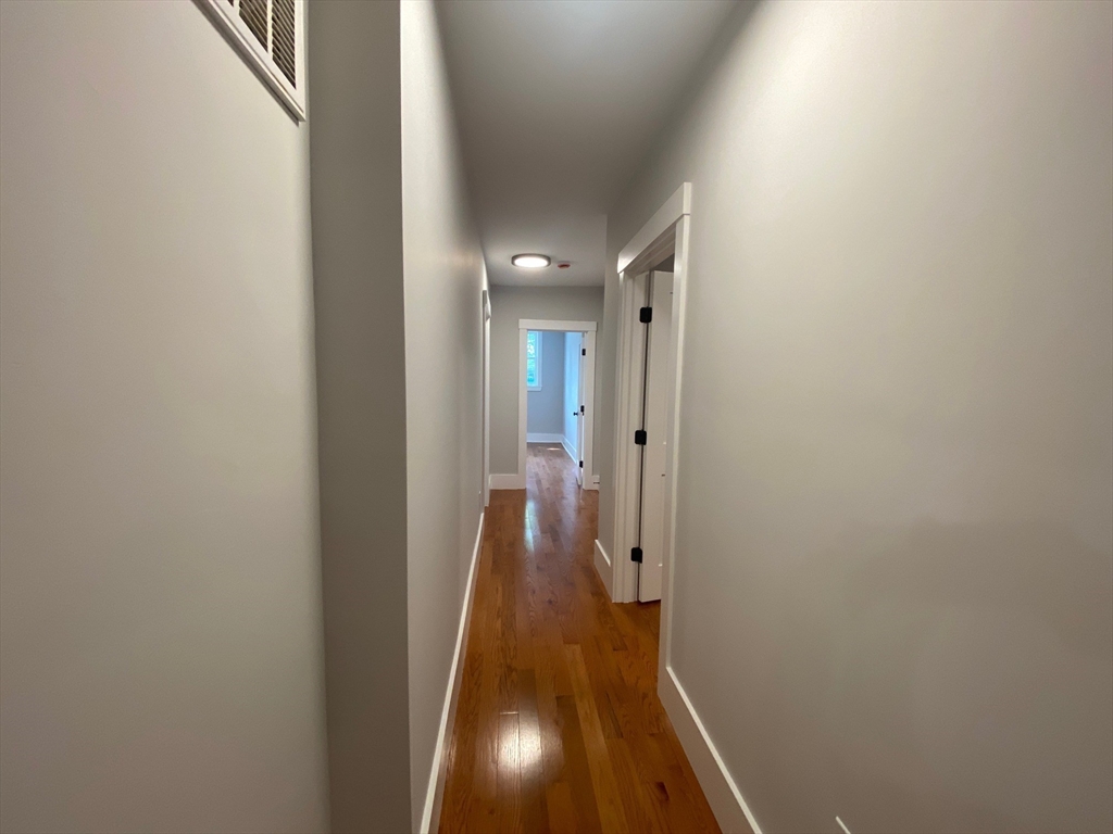 120 Marginal Street, Unit 1 Boston, MA 02128 - Photo 17 of 18 a view of hallway with wooden floor