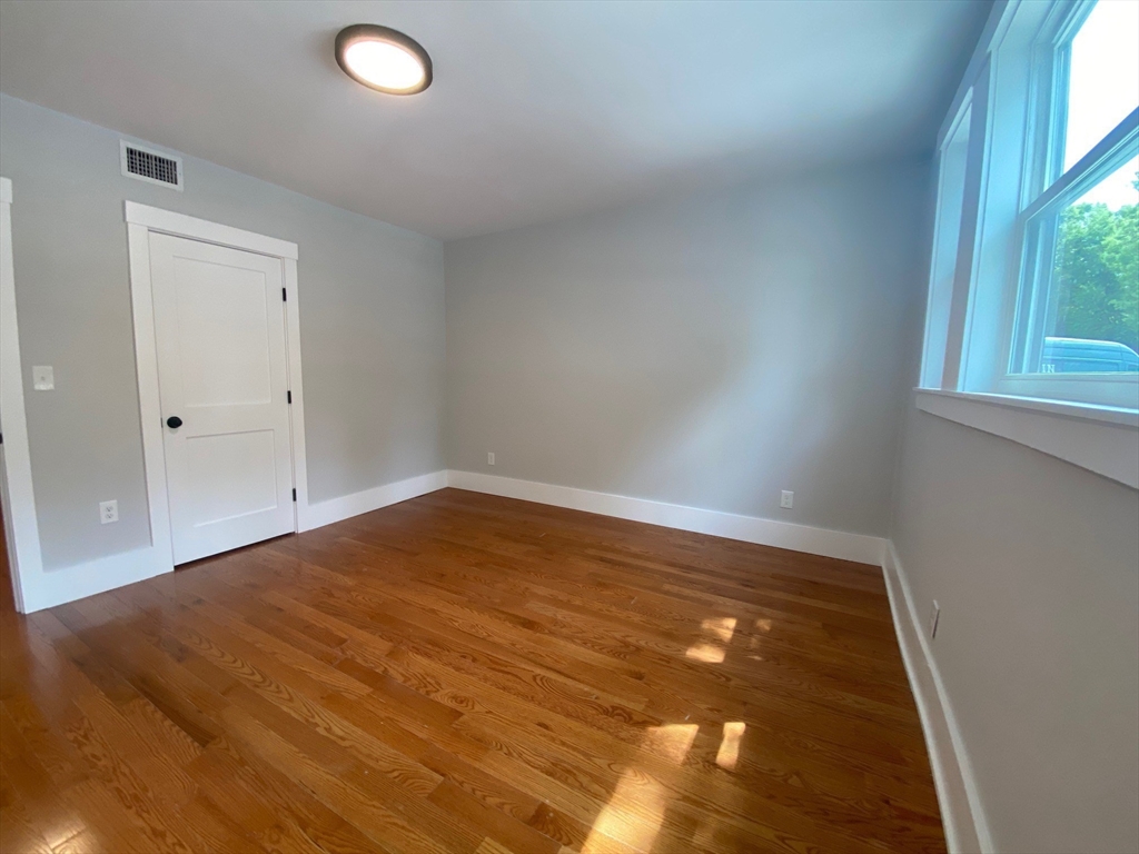 120 Marginal Street, Unit 1 Boston, MA 02128 - Photo 8 of 18 an empty room with window