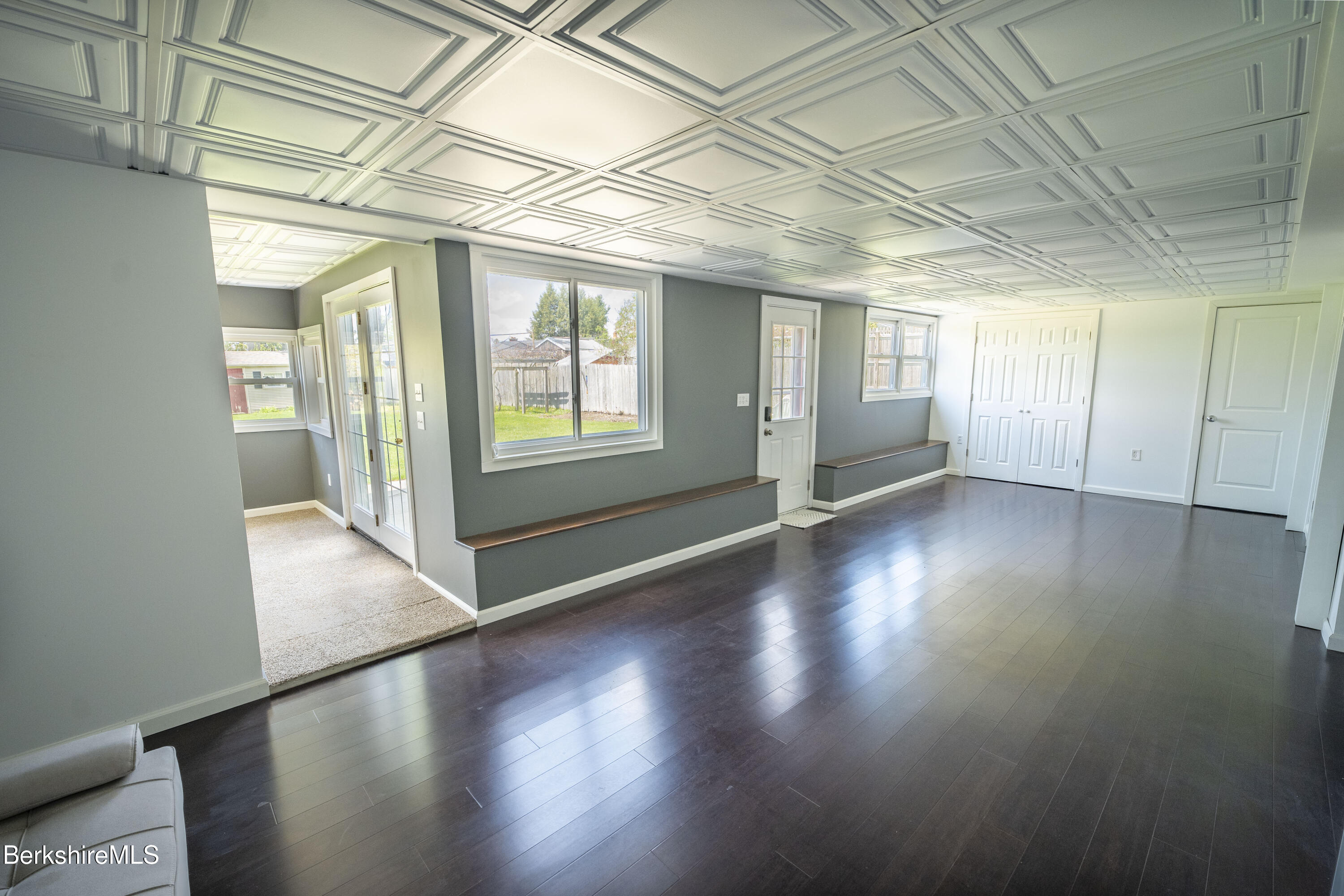 582 East New Lenox Road Pittsfield, MA 01201 - Photo 17 of 23 an empty room with wooden floor and windows
