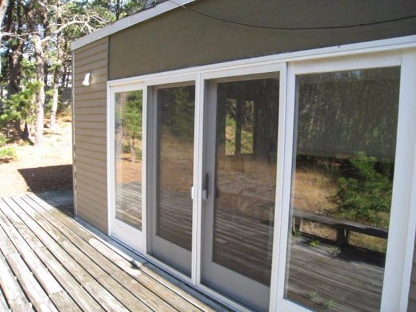 150 Anawan Road Wellfleet, MA 02667 - Photo 11 of 27 a view of a glass door of the house