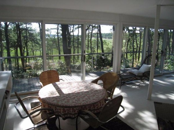 150 Anawan Road Wellfleet, MA 02667 - Photo 17 of 27 a view of a dining room with furniture window and outside view