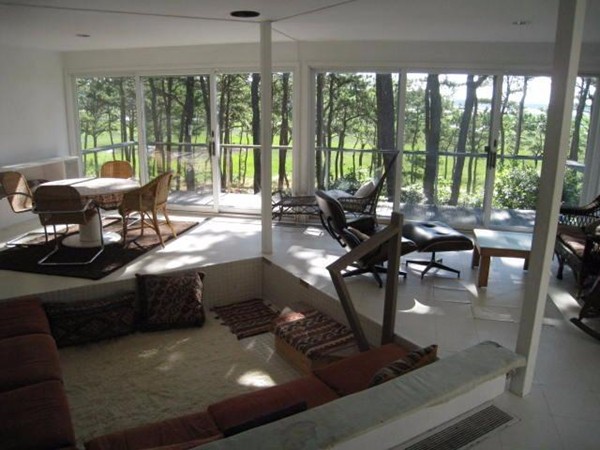 150 Anawan Road Wellfleet, MA 02667 - Photo 20 of 27 a living room with large windows and furniture
