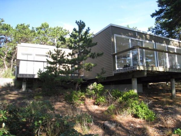 150 Anawan Road Wellfleet, MA 02667 - Photo 5 of 27 a front view of a house with a yard