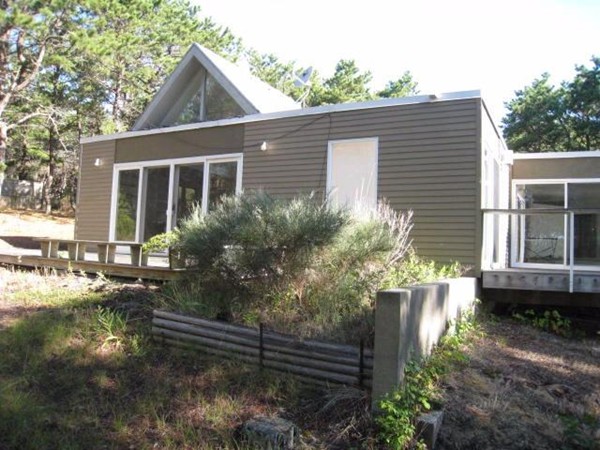 150 Anawan Road Wellfleet, MA 02667 - Photo 9 of 27 a front view of a house with garden
