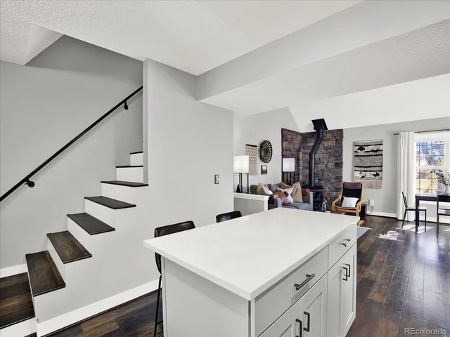 a view of living room with furniture and wooden floor