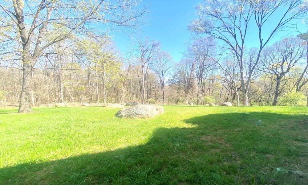 3822 Poplar Tent Road Concord, NC 28027 - Photo 13 of 13 a swimming pool with outdoor seating and yard