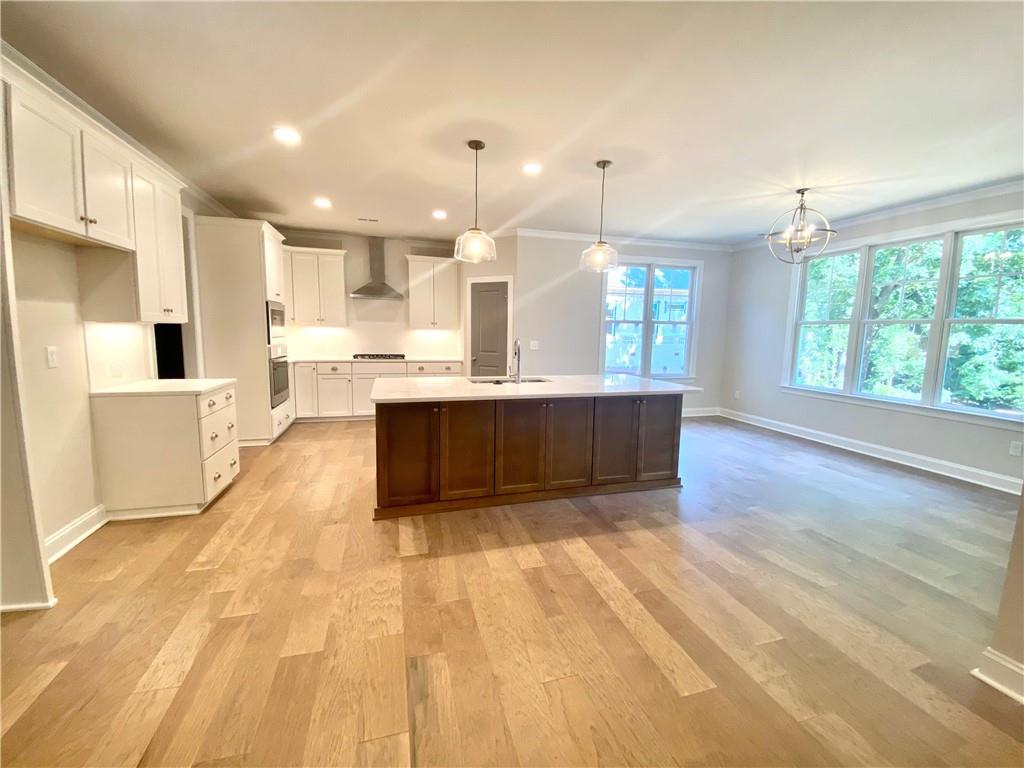 3822 Poplar Tent Road Concord, NC 28027 - Photo 8 of 13 a view of kitchen with granite countertop cabinets and refrigerator