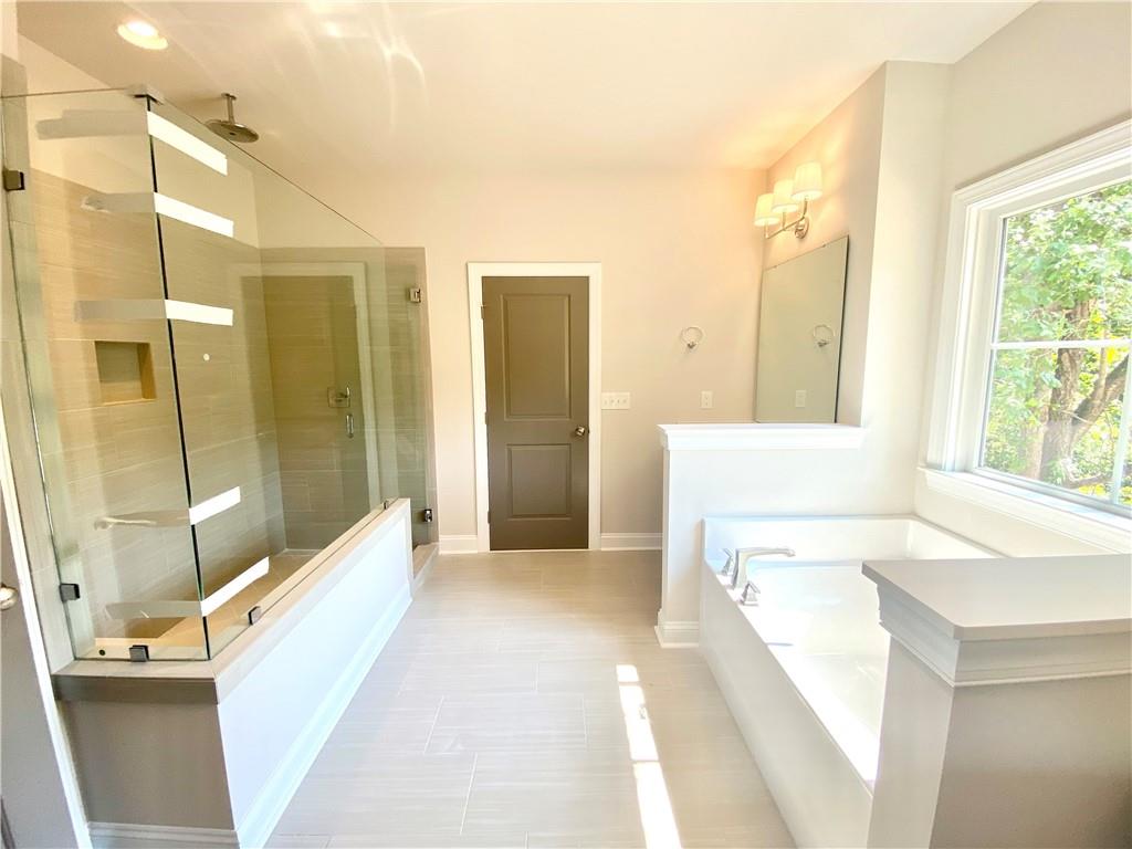 3822 Poplar Tent Road Concord, NC 28027 - Photo 10 of 13 a bathroom with a tub shower and sink