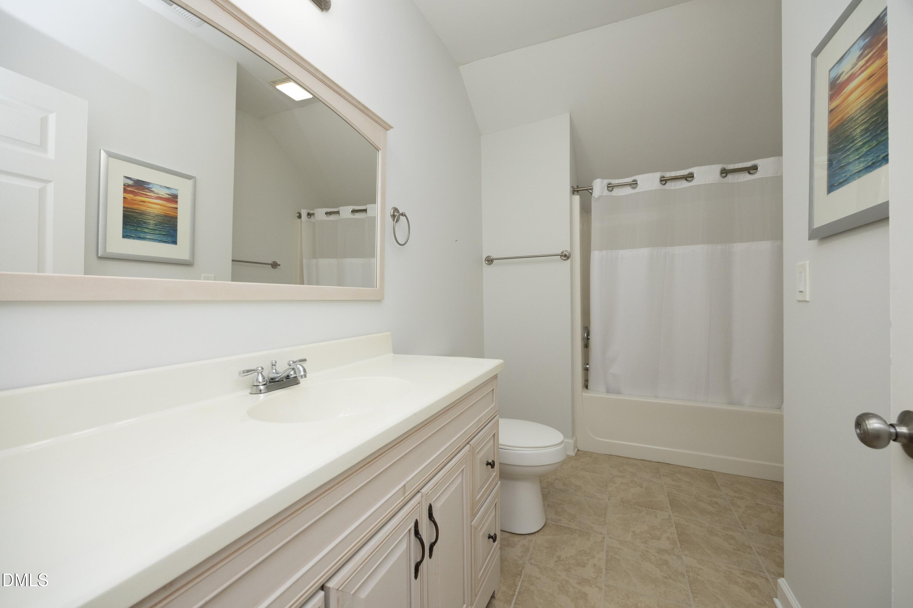 1427 Moosecreek Drive Raleigh, NC 27614 - Photo 31 of 51 a bathroom with a sink a toilet and shower
