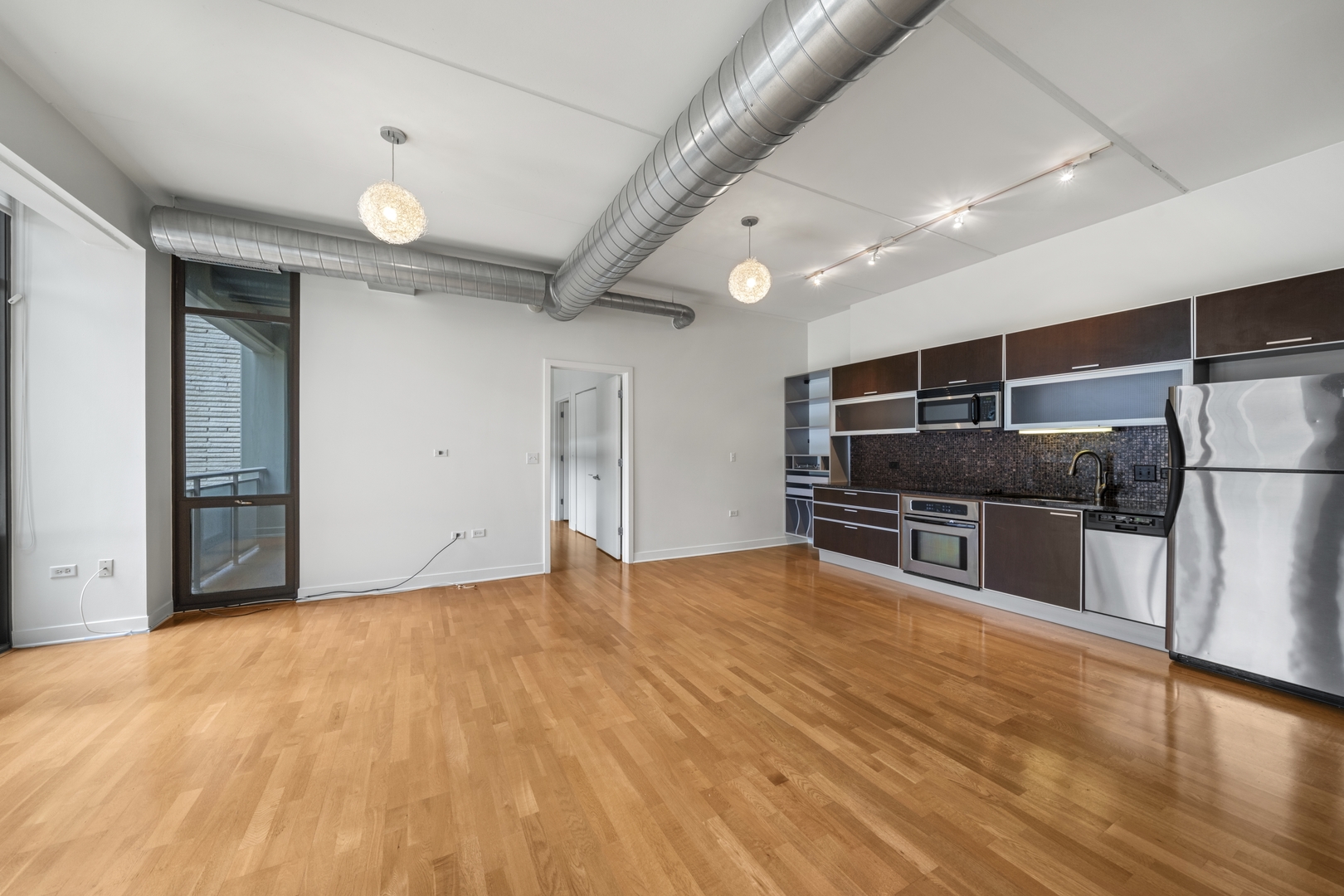 660 West Wayman Street, Unit 201B Chicago, IL 60661 - Photo 12 of 34 a view of a kitchen with a sink and stainless steel appliances