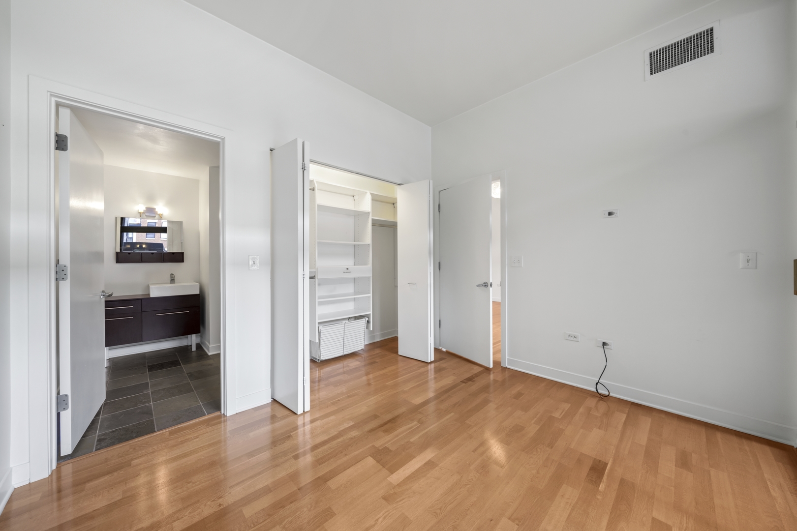 660 West Wayman Street, Unit 201B Chicago, IL 60661 - Photo 19 of 34 a view of a room with a stylish ceiling fan and entryway