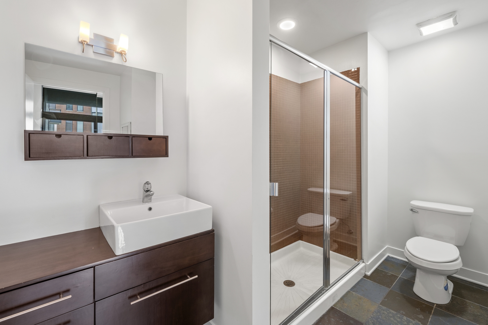 660 West Wayman Street, Unit 201B Chicago, IL 60661 - Photo 20 of 34 a bathroom with a sink a toilet and shower