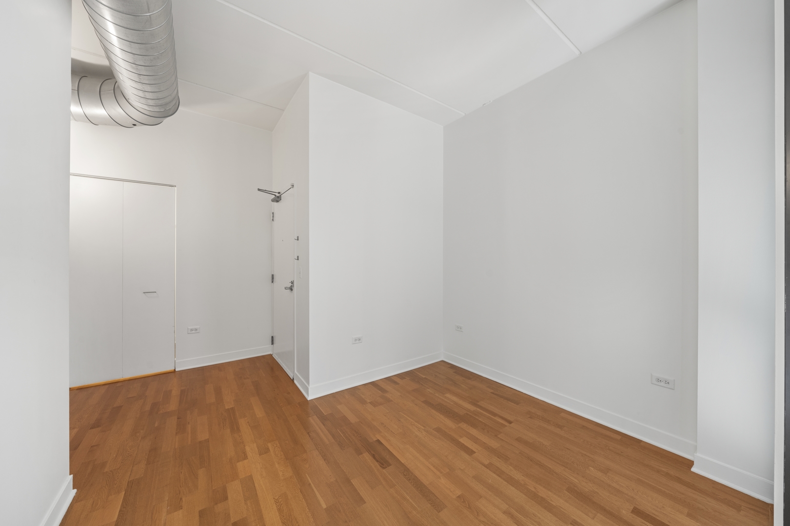 660 West Wayman Street, Unit 201B Chicago, IL 60661 - Photo 25 of 34 a view of empty room with wooden floor