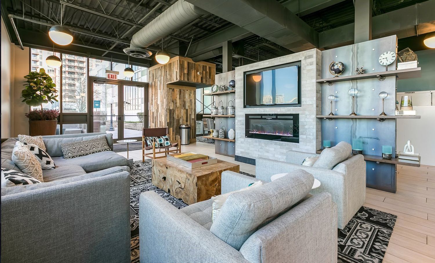 660 West Wayman Street, Unit 201B Chicago, IL 60661 - Photo 34 of 34 a living room with furniture a fireplace and a table