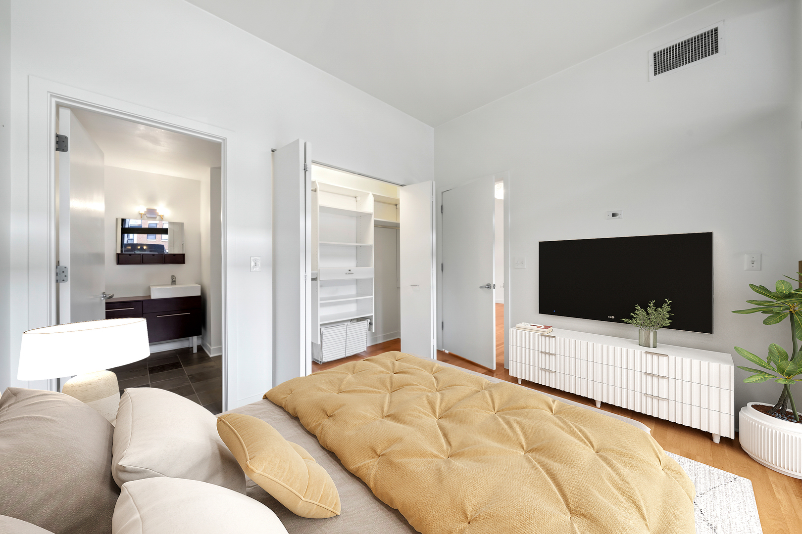 660 West Wayman Street, Unit 201B Chicago, IL 60661 - Photo 8 of 34 a bedroom with bed and a flat screen tv