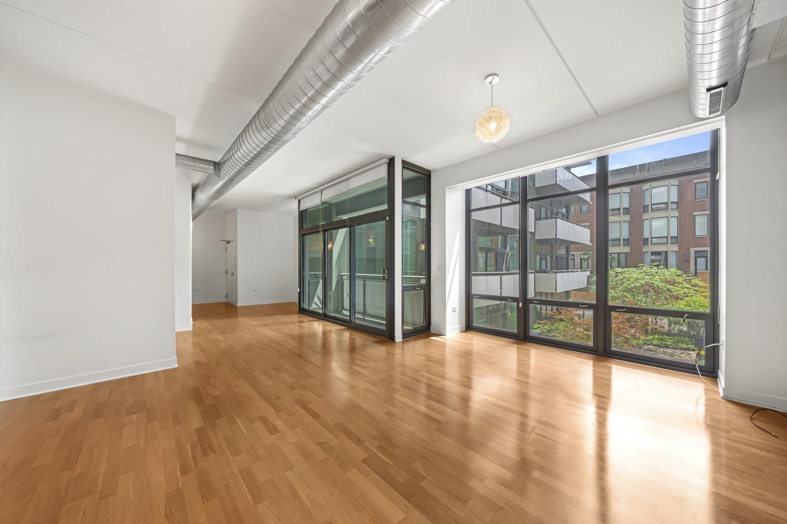 660 West Wayman Street, Unit 201B Chicago, IL 60661 - Photo 10 of 34 a view of an empty room with glass door